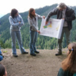 Description: Andrews scientist Fred Swanson explains the Blue River Management Plan to a tour group.