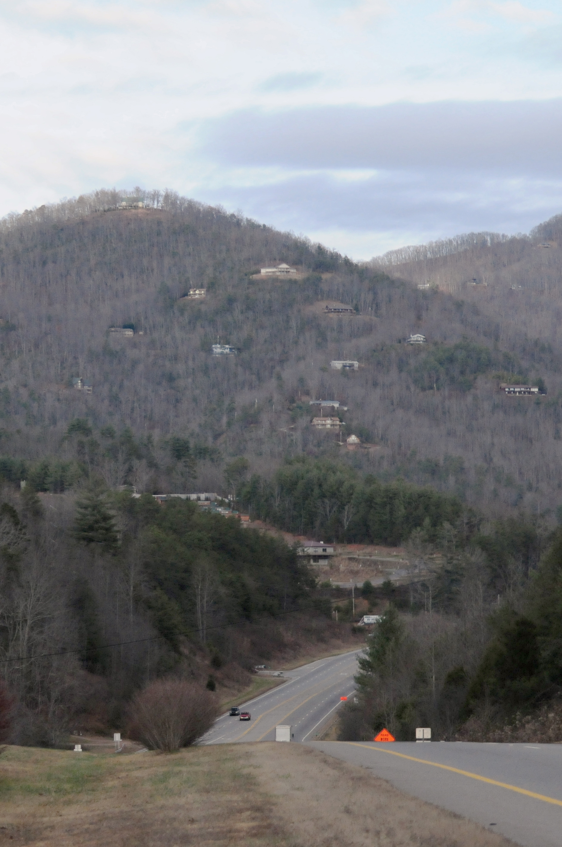 A view from the highway looks out over rural homes that speckle the foothills of Appalachia in the winter