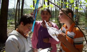 K-12 students collect plant growth data.