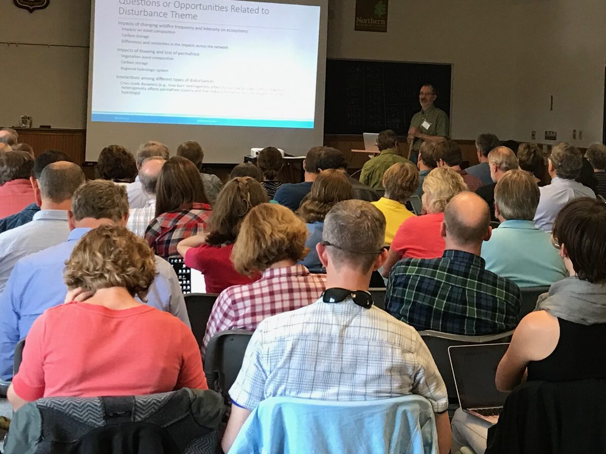 crowd of adults, attending to a lecture